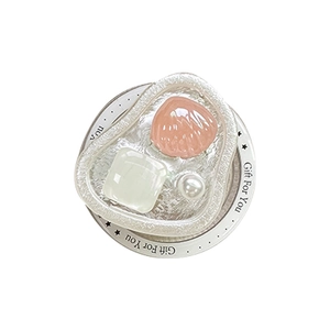 Pearlescent heart shell phone socket with white pearls and wave textured grip base