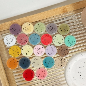 Polka dot round phone grip stand in vibrant multi-colors with smooth resin finish
