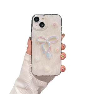 Luxurious iPhone case with 3D iridescent bow and silver pearls on white glitter finish