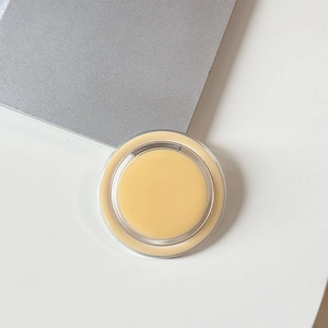 Macro detail of clear magnetic phone stand showing the solid balm inner texture