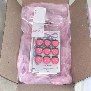 Clear iPhone case with 3D resin pink strawberry charms and branded retail packaging