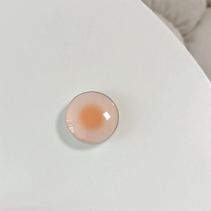 Macro shot of circular phone socket with pink orange gradient and high gloss finish