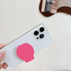 Pink leather taiyaki phone socket grip with stitching detail on a white smartphone