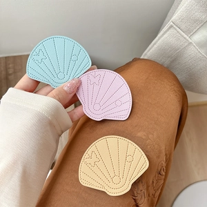 Chic shell-shaped leather phone socket grips in pastel colors with butterfly accents
