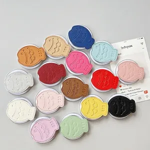 Leather fish-shaped pop socket phone holders in 15 colors with lychee texture finish