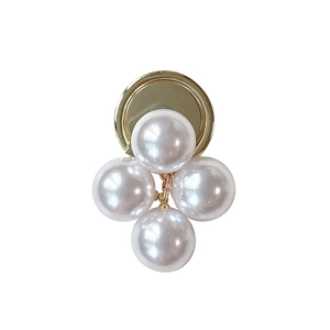 Elegant white pearl cluster phone grip with a polished gold circular base on white background