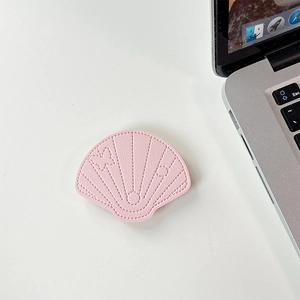 Close-up of pink leather shell phone grip showing fine stitching and leather texture