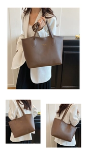 Détail d'un grand sac cabas en cuir marron avec inscription dorée Fashion bag NEW YORK