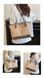 Détail d'un grand cabas beige et marron avec coutures contrastées et lettrage doré
