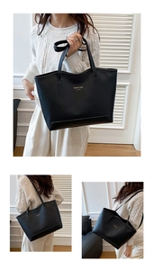 Détail du grand sac cabas noir avec lettrage doré porté par un mannequin dans un décor cosy