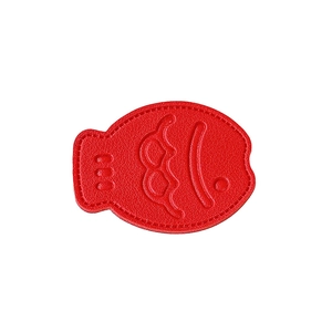 Solid red leather fish-shaped phone socket grip with lychee texture and stitched edges