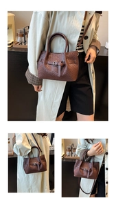 Detailed macro view of deep brown woven texture and metallic buckle on bucket bag
