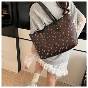 Large capacity tote bag featuring red cherry prints and golden rivet details on handles
