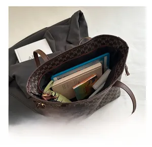 Interior view of large retro brown monogram tote bag showing spacious capacity for daily items
