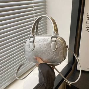 Silver PU leather bowling bag with embossed playful patterns and detachable shoulder strap