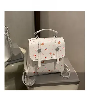 Détail du sac à dos blanc en PU avec imprimés de chiots et cerises pour femmes