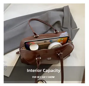 Spacious interior of brown vintage Boston bag showing space for tablet and makeup