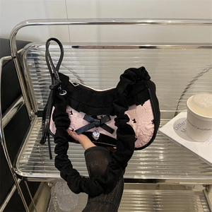 Pink and black underarm bag with rabbit logo, bow detail and ruffled handle