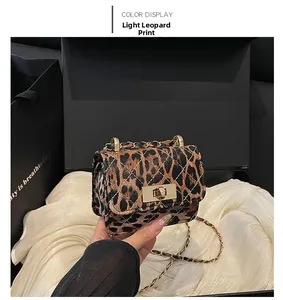 Detail of light leopard print mini bag with quilted pattern and gold chain strap