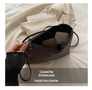 Interior view showing the large capacity of the vintage rhinestone underarm bag