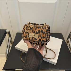 Mini leopard print crossbody bag with gold chain strap and quilted leopard fur texture