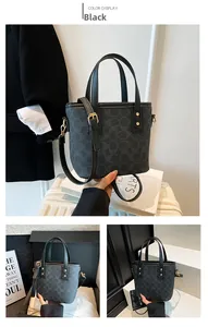 Detailansicht der schwarzen Eimer-Tasche mit Monogramm, Ledergriffen und Goldnieten