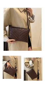 Detail of dark brown quilted underarm bag showing versatile styling with rivets