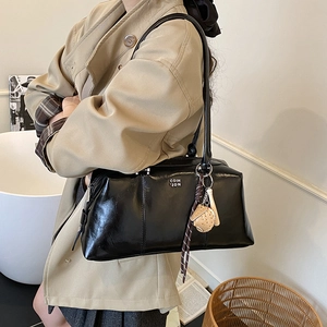 Retro black leather bowling handbag with letter print and baseball charm accessory