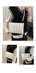 Detail of white quilted underarm bag with black rivets and slim shoulder strap