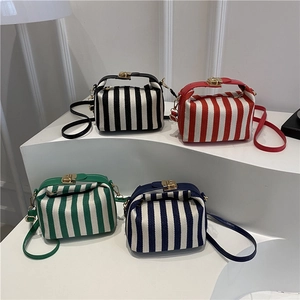 Minimalist striped crossbody square bags in black, red, green and blue with gold hardware
