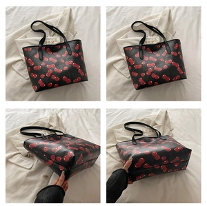 Detail view of large cherry print tote bag showing various angles and spacious interior