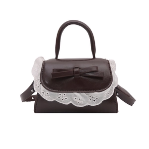 Mini brown bow shoulder bag with white lace trim and vintage lolita style aesthetic