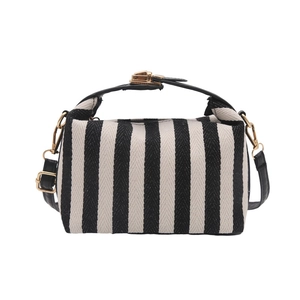 Gestreifte Canvas-Handtasche mit schwarzem Ledergriff und goldenem Metallverschluss