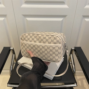 Minimalist creamy white camera crossbody bag featuring grey M-letter print and strap