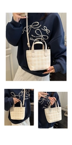Detail showing cream checkered tote bag with top handles and adjustable shoulder strap