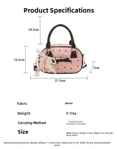 Pink Boston bag dimensions showing width 21.5cm, height 13.5cm and black bow detail