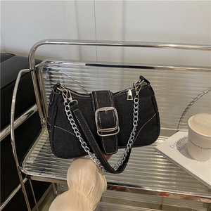 Retro black denim underarm bag with white stitching and chunky silver metal buckle