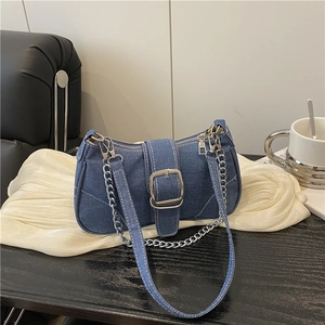Denim shoulder bag with contrast stitching and silver chain strap for casual styling