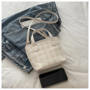 Detailed view of checkered crossbody bag with adjustable strap and size comparison