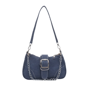 Blue denim crossbody bag with metal chain strap and buckle detail on white background