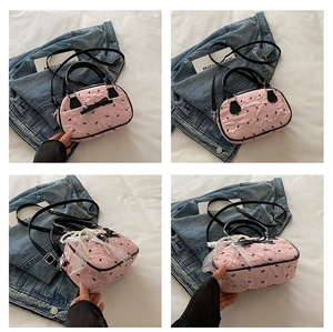 Detailed views of pink bubble texture handbag with lace bow and pearl decoration