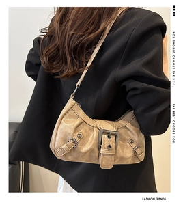 Close-up of khaki retro underarm bag with textured PU fabric and metal buckle details