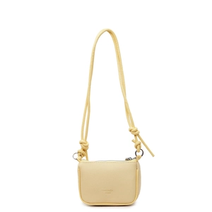 Minimalist light yellow crossbody bag in pebbled leather with top zipper and knot strap