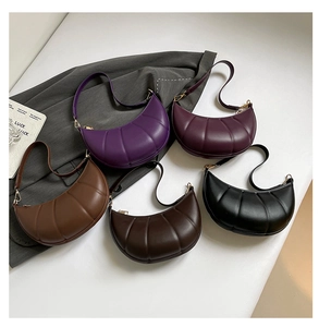 Detailed flat lay of padded PU leather crescent bags in multiple fashion colors