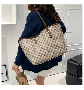 Model view showing the large capacity tote bag size and retro printed design