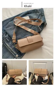 Detail of khaki rectangular crossbody bag with adjustable wide fabric shoulder strap
