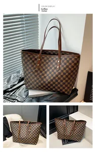 Detail view of large tote bag with brown checkerboard pattern and reinforced stitching