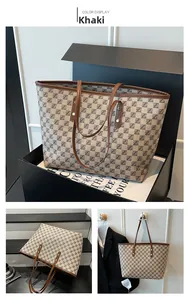 Detailed close-up of khaki plaid tote bag with Z-pattern and premium gold rivet accents