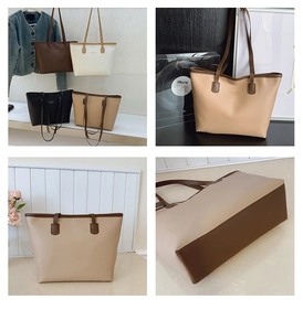 Detalle de las costuras y la base reforzada del bolso tote grande de diseño contrastado