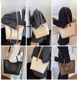 Detalle de bolsos tote grandes en cinco colores con textura de cuero de alta gama